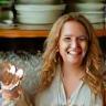 Gemma K. holding up new kitchenware purchase